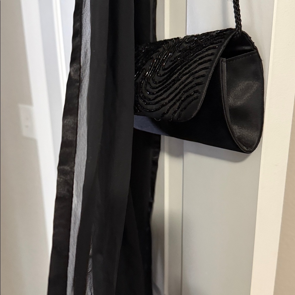 Elegant Black Beaded Evening Clutch
Plus free sheer shoulder wrap. - Picture 5 of 10